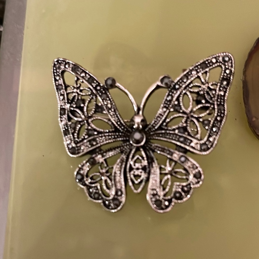 Butterfly brooch silver toned with marquisette